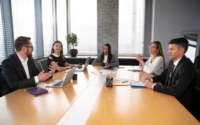 medium-shot-team-sitting-table_23-2149271747