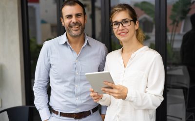 portrait-happy-mid-adult-businessman-young-businesswoman_1262-17977